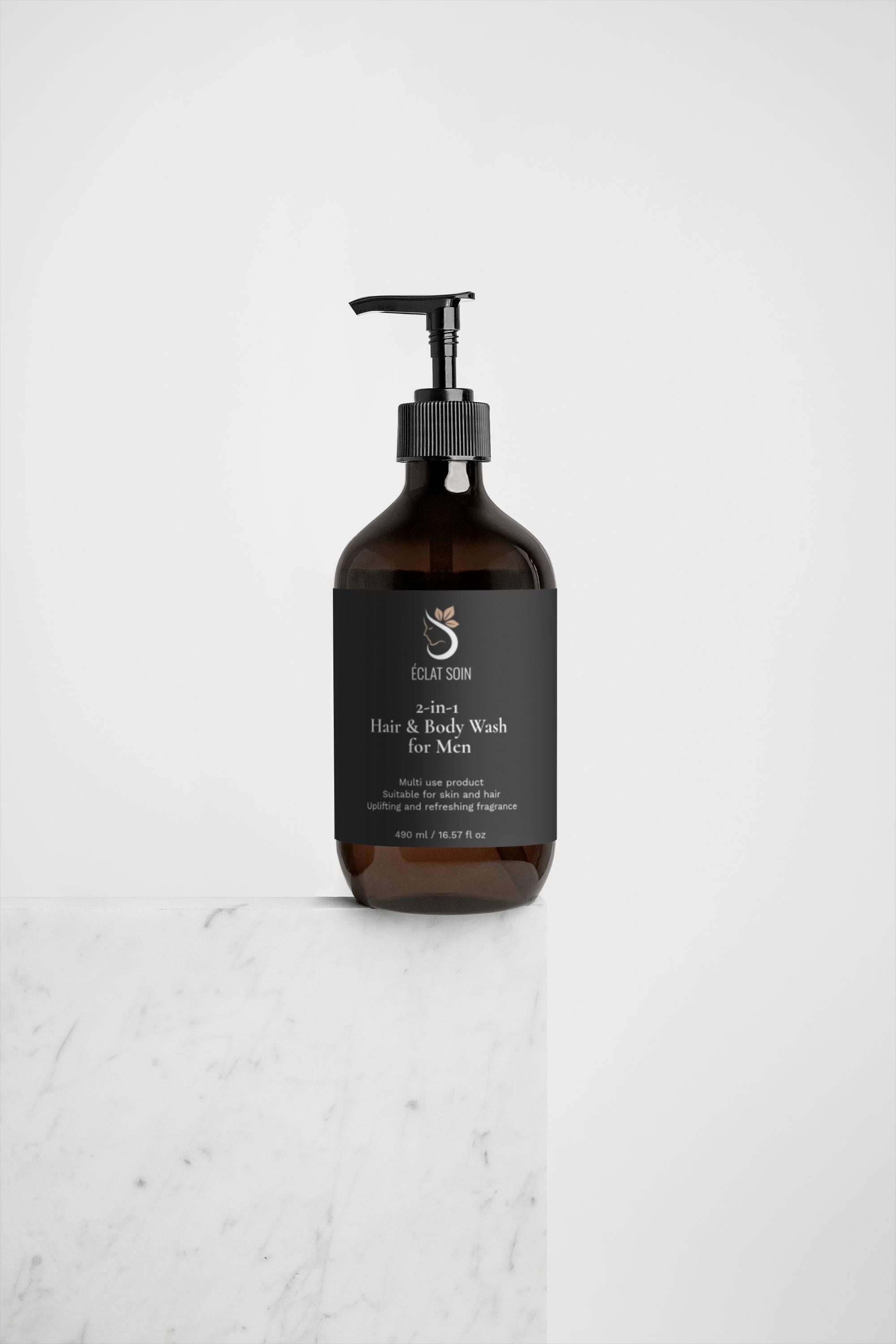 Eclat Soin 2-in-1 Hair & Body Wash for Men in a brown pump bottle on a marble surface