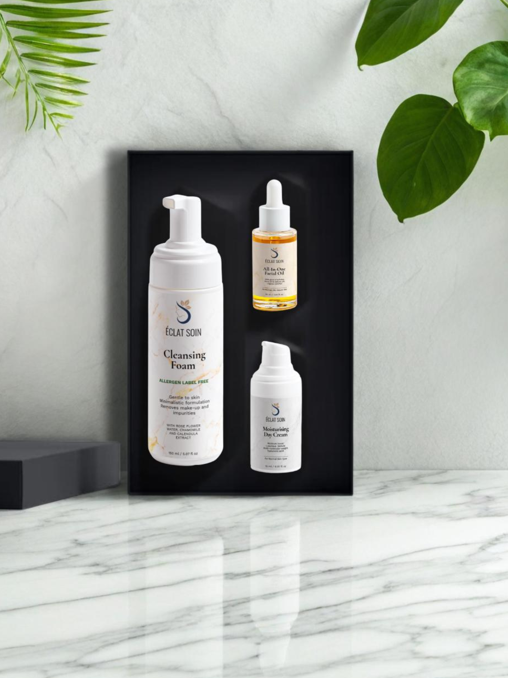 Daily Radiance Skincare Collection Box featuring Cleansing Foam and two serums on a marble surface