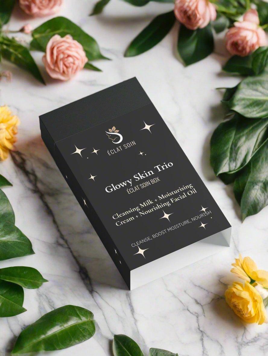 Eclat Soin Glowy Skin Trio Collection Box featuring cleansing, moisturizing, and nourishing facial oil