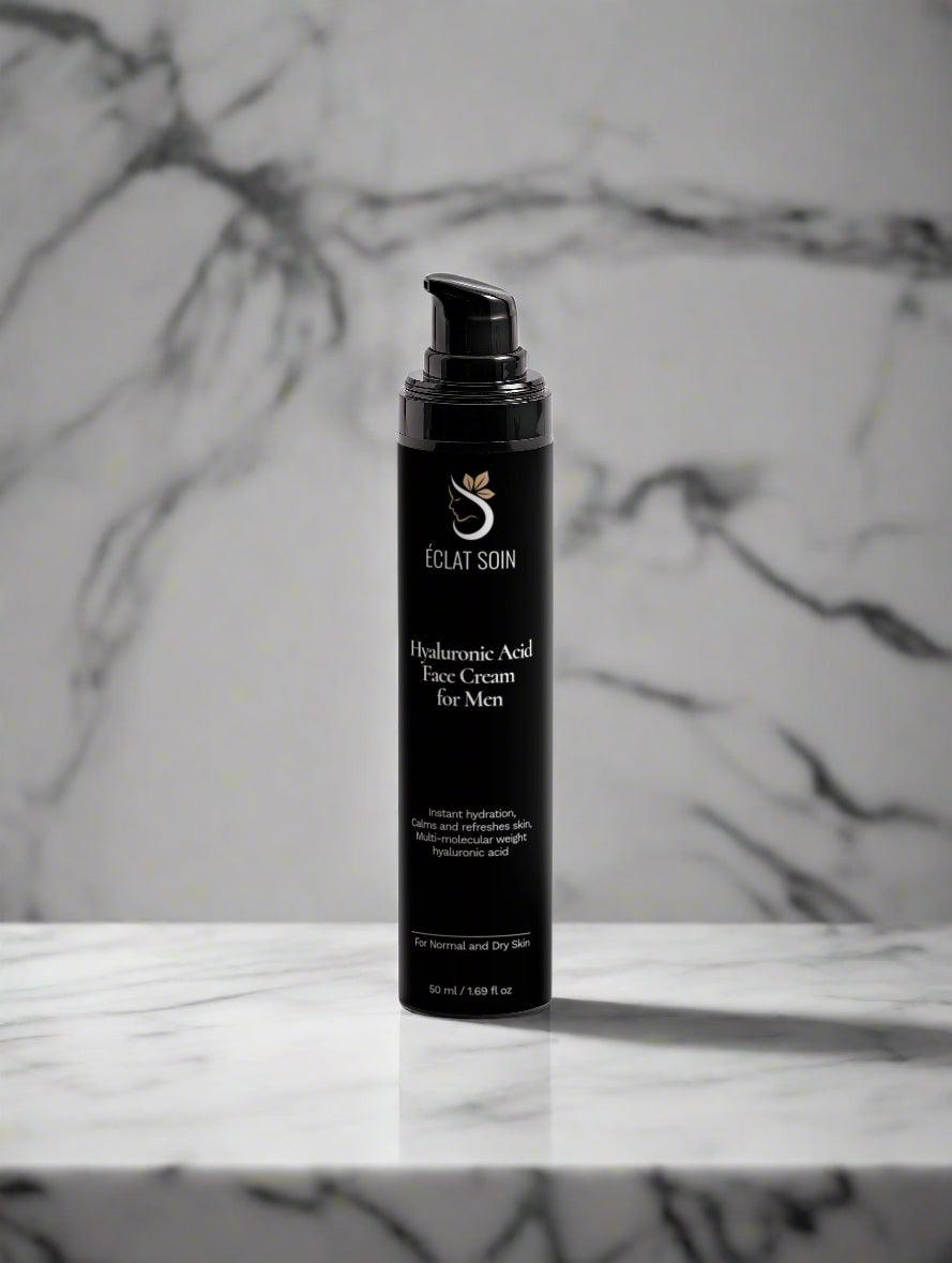 Eclat Soin Hyaluronic Acid Face Cream for Men in a sleek black bottle on a marble surface
