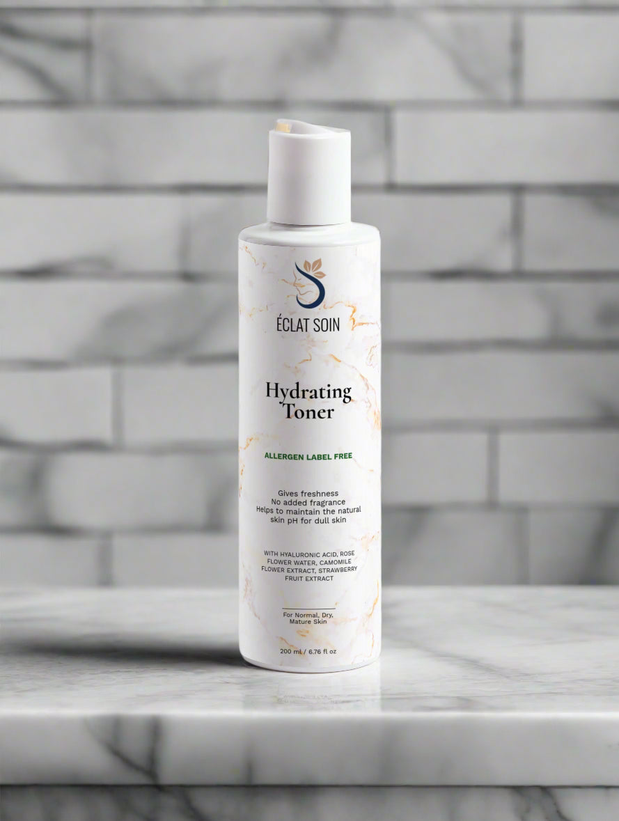 Eclat Soin Hydrating Toner with Glow Essence for All Skin Types in a white bottle on marble surface