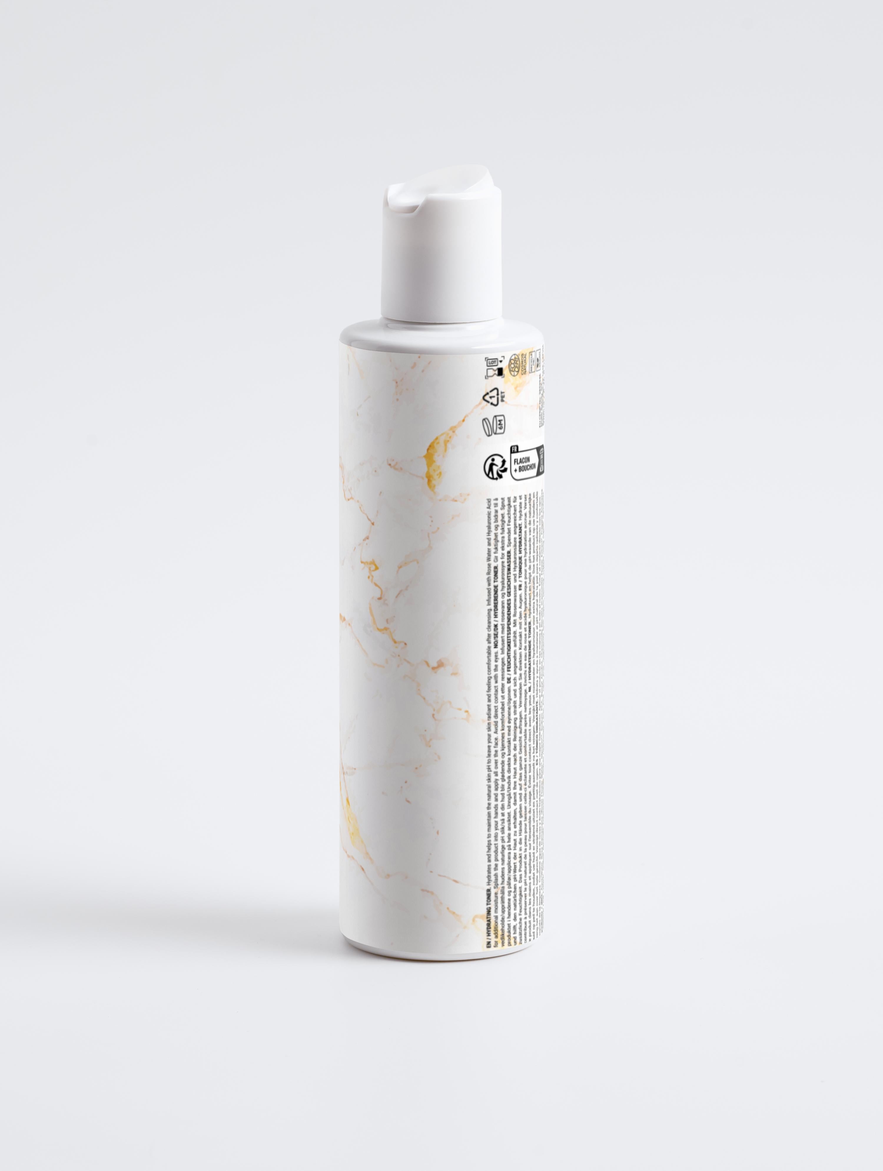 Eclat Soin Hydrating Toner in a sleek marble-designed bottle for skin hydration