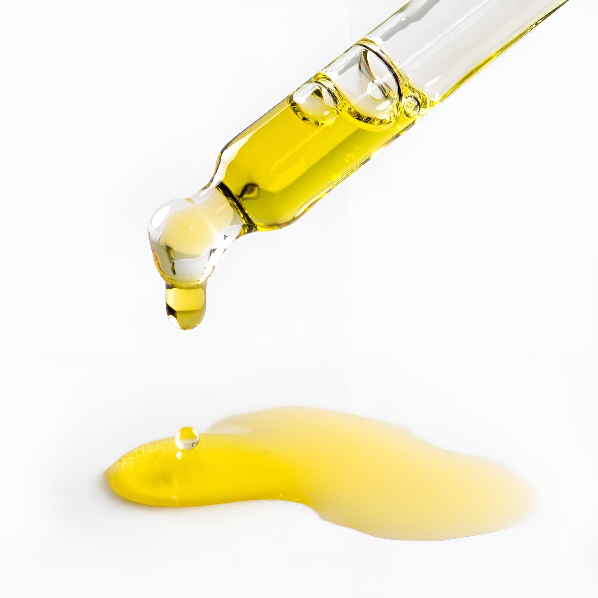 Eclat Soin Natural Retinol-Alternative Oil Serum in a dropper with a droplet falling onto a surface