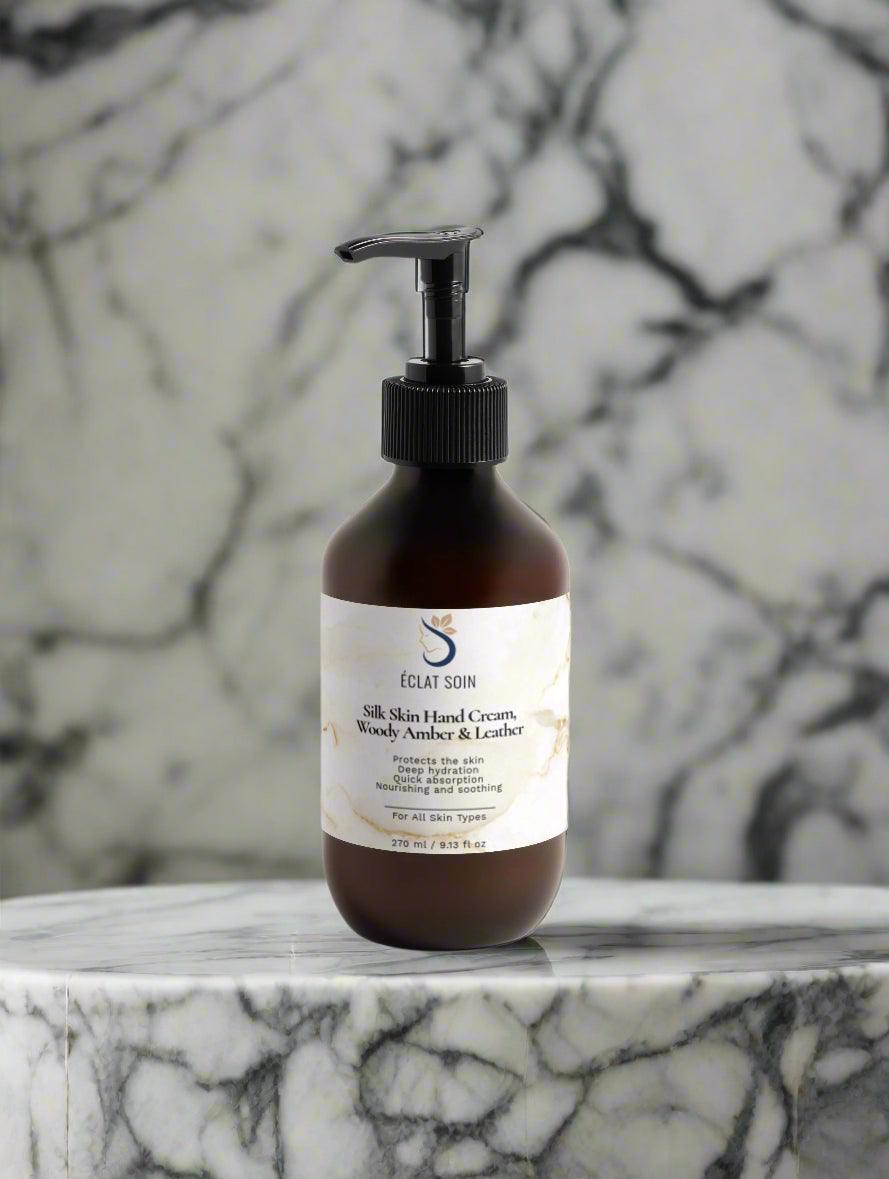 Eclat Soin Silk Skin Hand Cream in a pump bottle with a marble background for hydrating skin