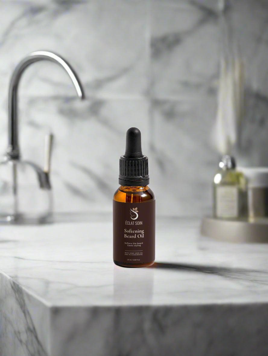 Eclat Soin Softening Beard Oil in a glass bottle on a marble countertop with modern bathroom fixtures