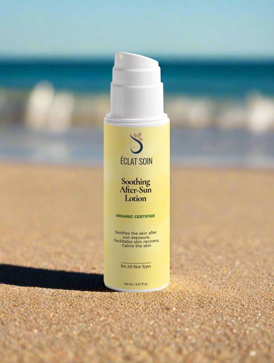 Eclat Soin Soothing After-Sun Lotion bottle on sandy beach with ocean in background