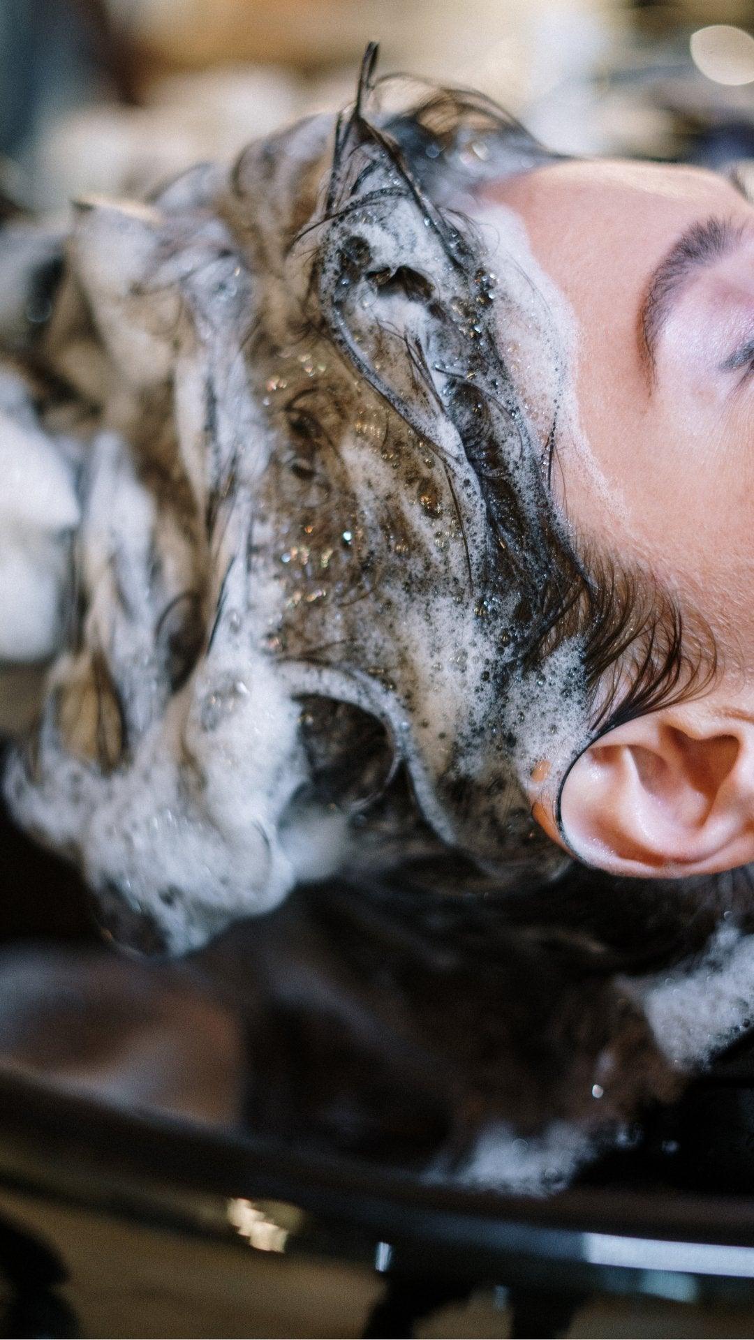 Eclat Soin Moisturising Shampoo lathering on hair for deep hydration and smoothness