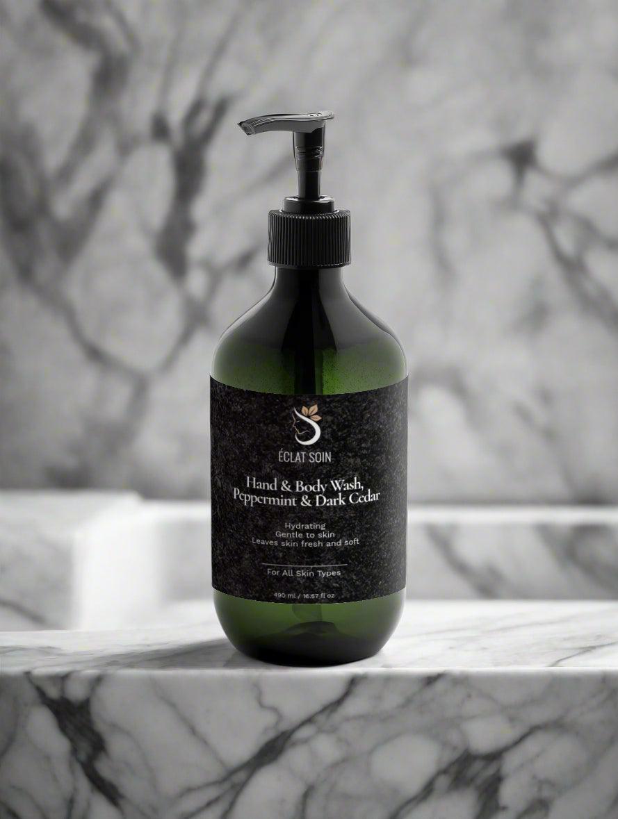 Eclat Soin Natural Peppermint Body Wash in a dark bottle with a pump on a marble surface